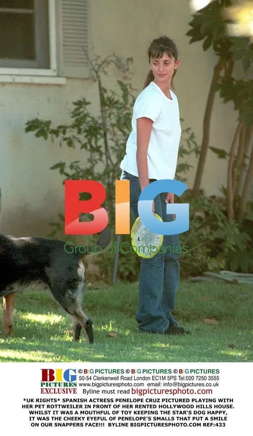 Penelope Cruz plays with pet Rottweiler
