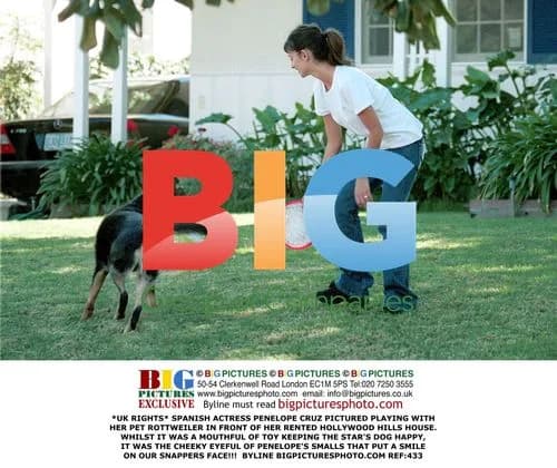 Penelope Cruz Playing with Pet Rottweiler