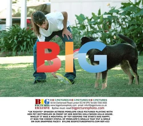 Penelope Cruz Plays with Pet Rottweiler
