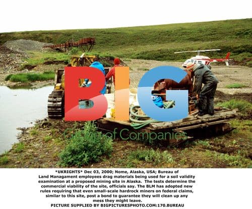 BLM Employees Examine Mining Site