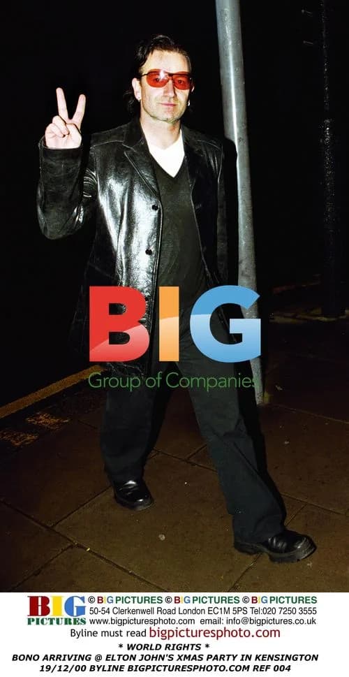 Bono Arrives at Elton John's Christmas Party