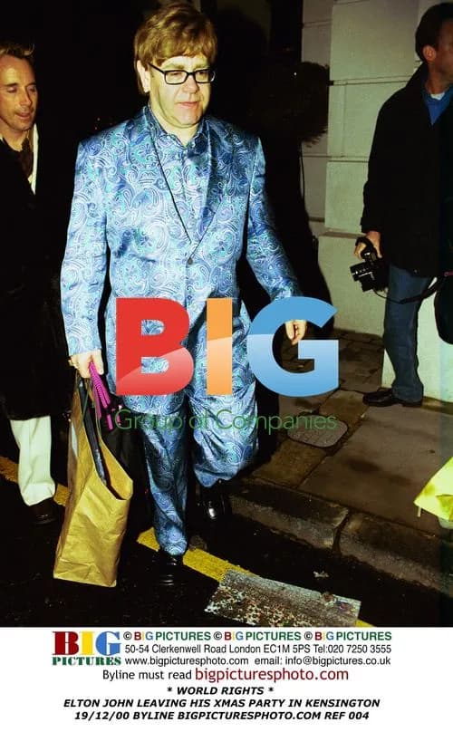 Elton John leaves Christmas party in Kensington