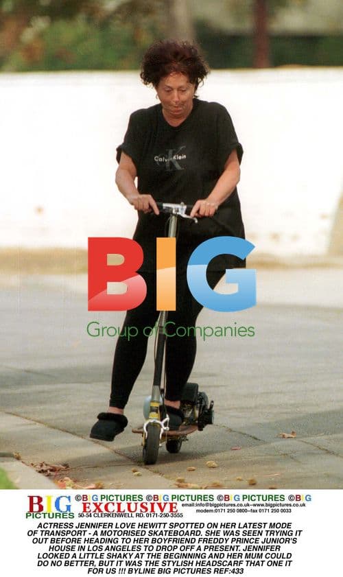 Jennifer Love Hewitt on Motorized Skateboard