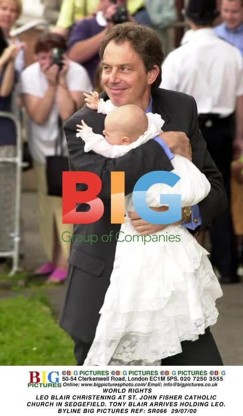 Tony Blair Arrives Holding Son Leo at Christening