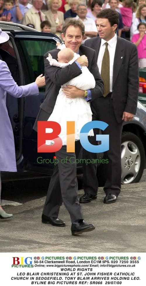 Tony Blair Arrives Holding Son Leo at Christening