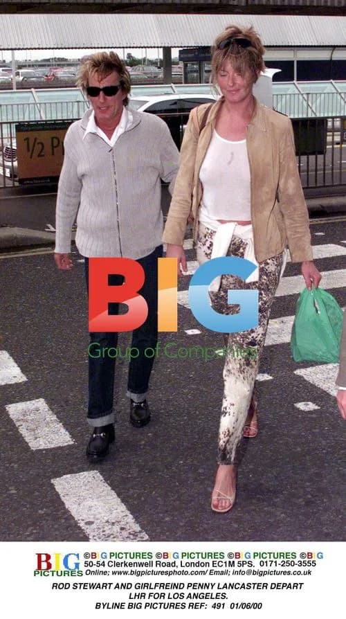 Rod Stewart and girlfriend Penny Lancaster depart London