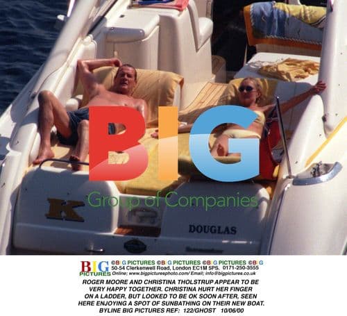 Roger Moore and Christina Tholstrup Relax on Boat