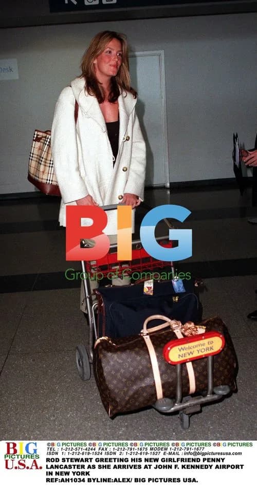 Rod Stewart greets girlfriend Penny Lancaster at JFK