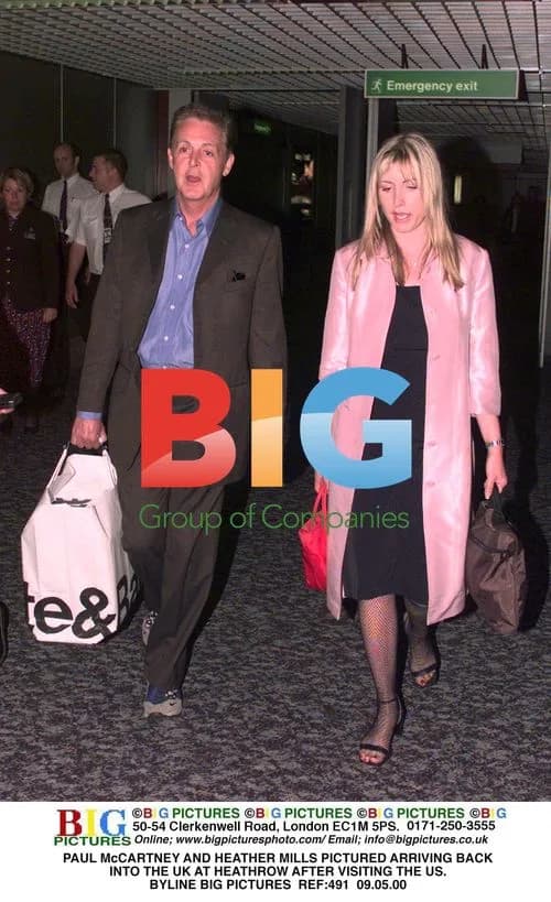Paul McCartney and Heather Mills arrive at Heathrow