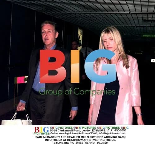 Paul McCartney and Heather Mills Arrive at Heathrow