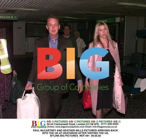 Paul McCartney and Heather Mills arrive at Heathrow