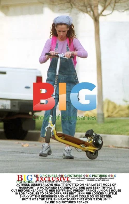 Jennifer Love Hewitt on motorized skateboard