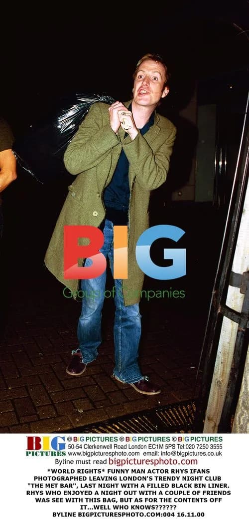 Rhys Ifans Leaves London Club with Bin Liner