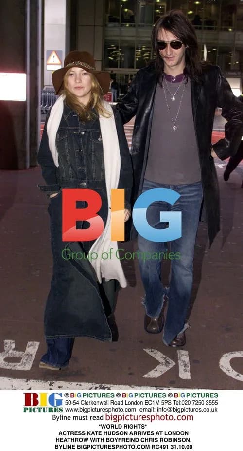 Kate Hudson arrives at London Heathrow with Chris Robinson