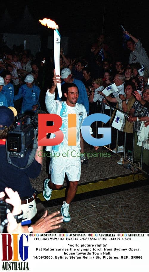 Pat Rafter carries Olympic torch in Sydney