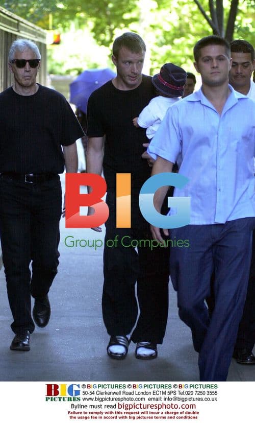 Guy Ritchie and son Rocco arrive home in NYC