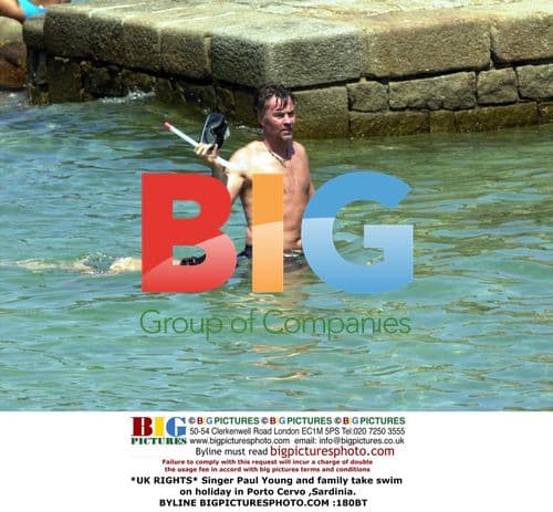 Paul Young and family swimming in Sardinia