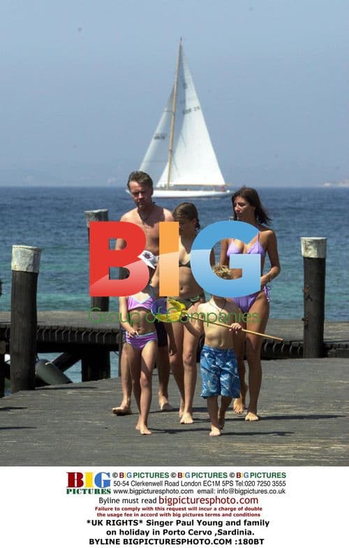 Paul Young and family swim in Sardinia