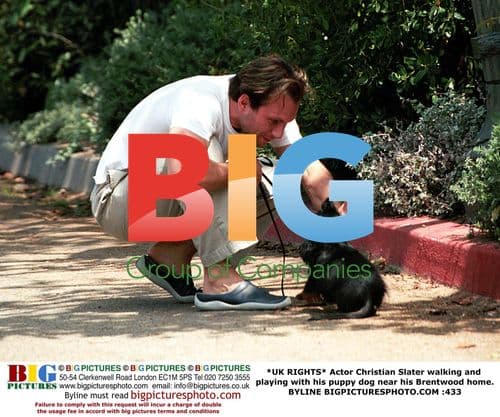 Christian Slater walks puppy near home