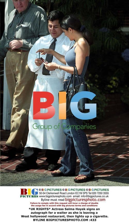 Salma Hayek signs autograph, smokes cigarette