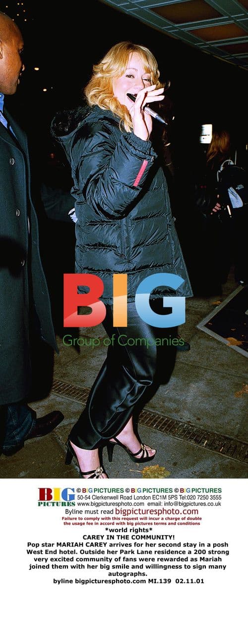 Mariah Carey Greets Fans Outside Hotel