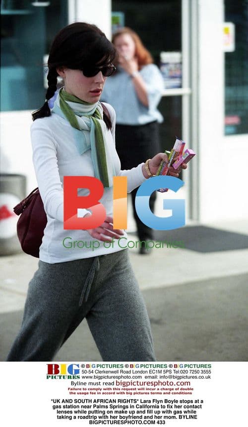 Lara Flyn Boyle fixes contact lens at gas station