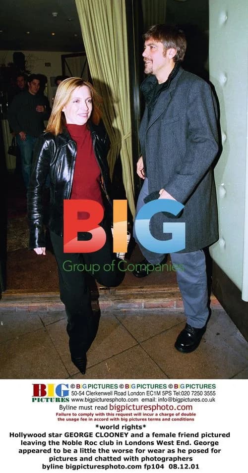 George Clooney leaving club with female friend