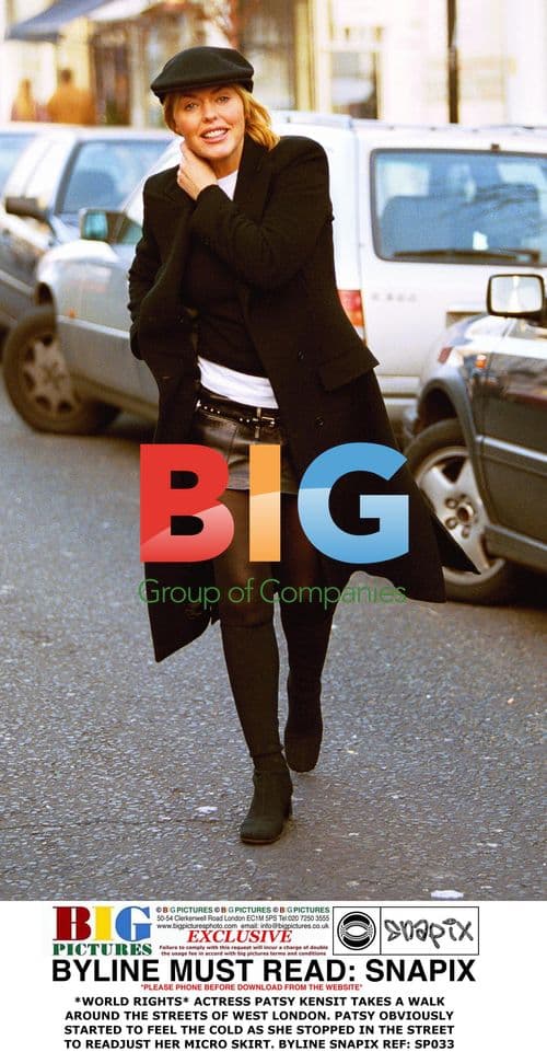 Patsy Kensit Adjusts Skirt in London