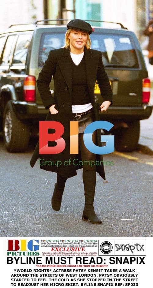 Patsy Kensit Adjusts Micro Skirt in West London