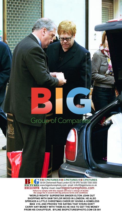 Elton John Out Shopping with Sam Taylor Wood in London