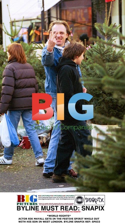 Rik Mayall Gets Festive with Son in West London