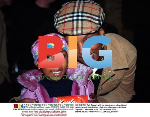 Rah Diggah and daughter at toy drive