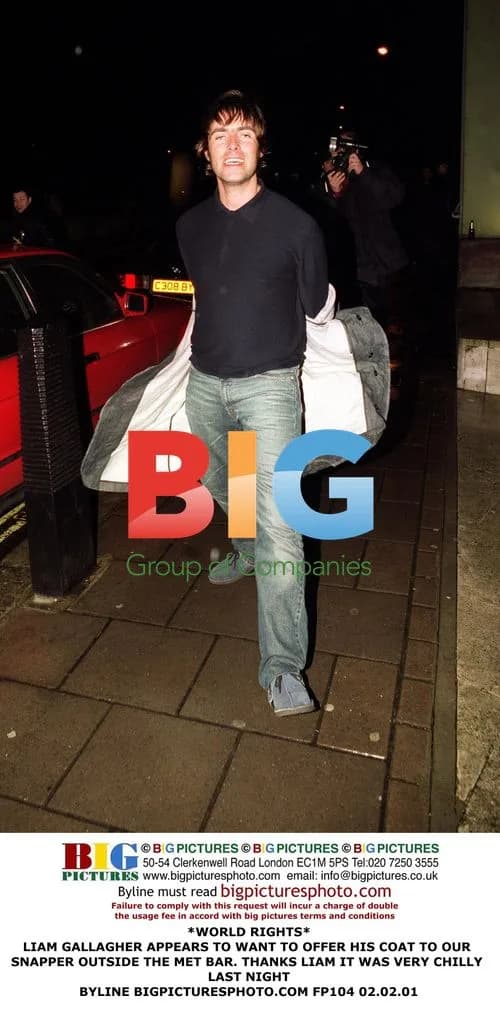 Liam Gallagher offers coat to paparazzi