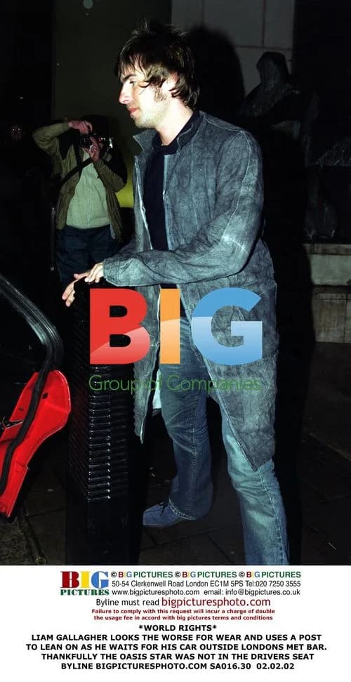 Liam Gallagher Leans on Post Outside Met Bar