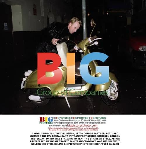 David Furnish Rides Golden Scooter in London