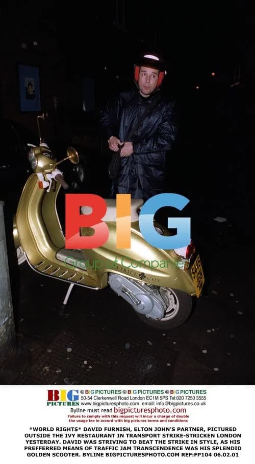 David Furnish Beats Transport Strike on Scooter