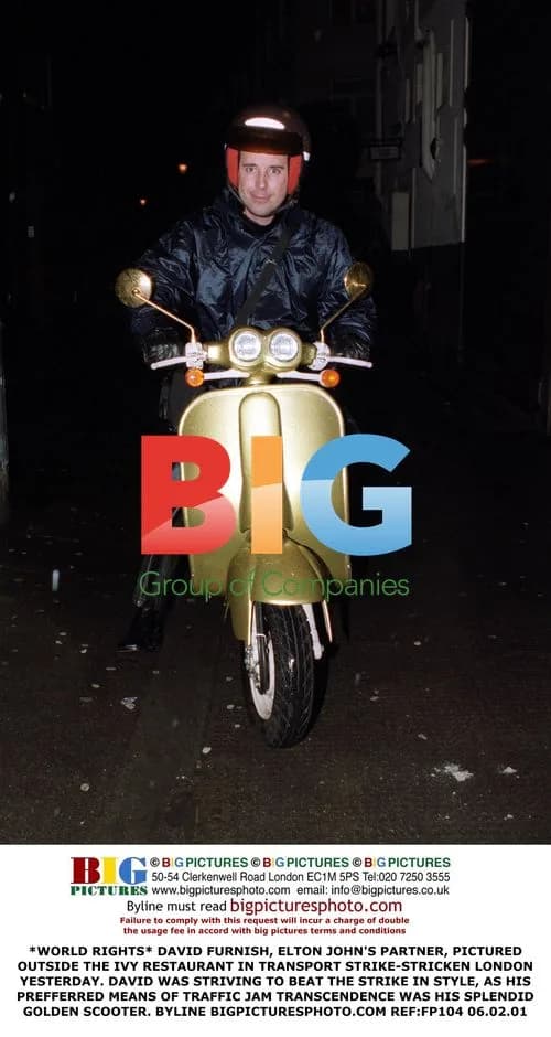 David Furnish Spotted Riding Golden Scooter