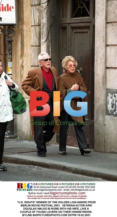 Kirk Douglas Walks with Wife in Rome