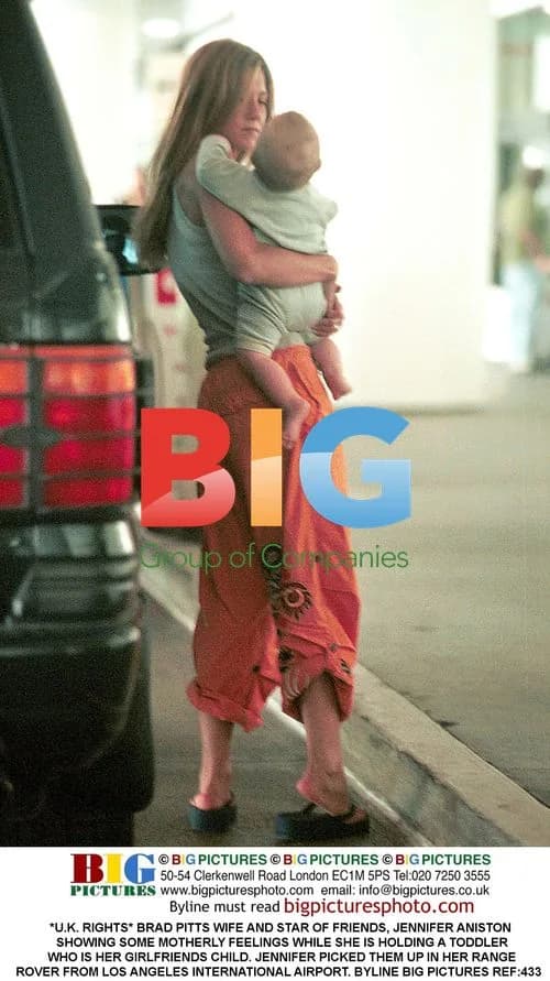 Jennifer Aniston Holding Toddler