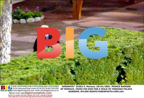 Prince Rainier walks dog in Palace Gardens