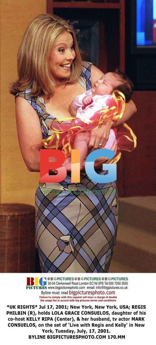 Regis Philbin holds Kelly Ripa's daughter