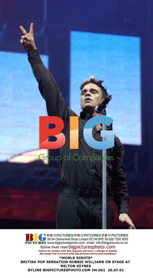 Robbie Williams Performs on Stage in Milton Keynes