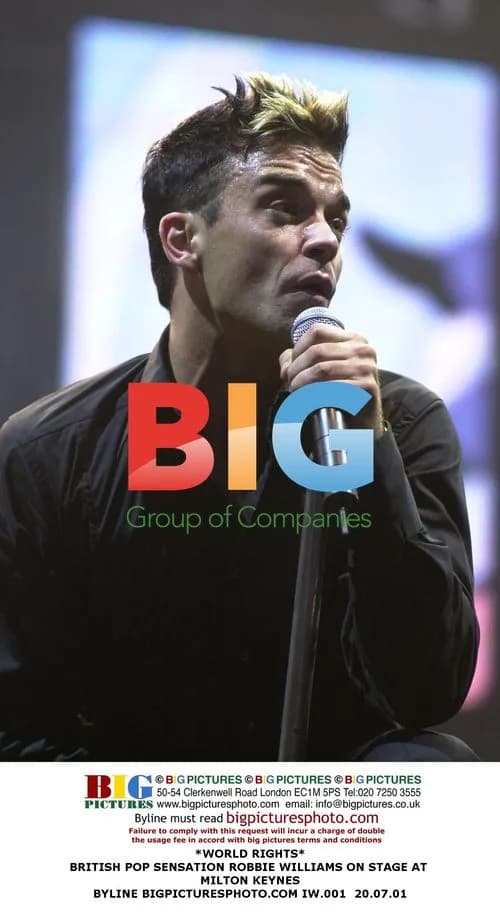 Robbie Williams performs on stage in Milton Keynes