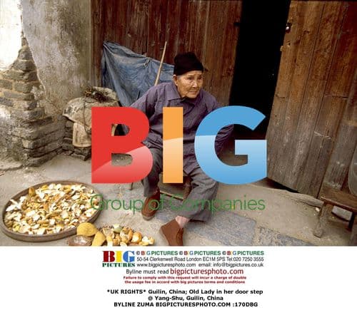 Old Lady in Guilin, China Door Step