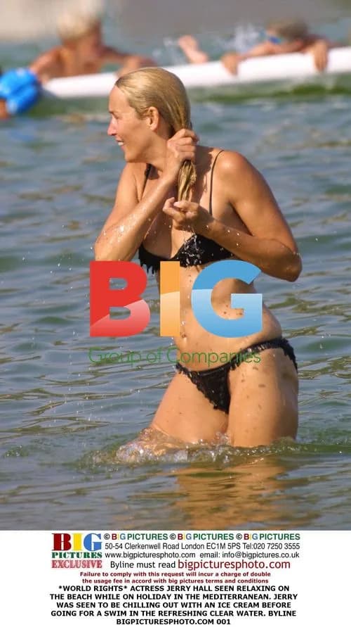 Jerry Hall Relaxing on Beach