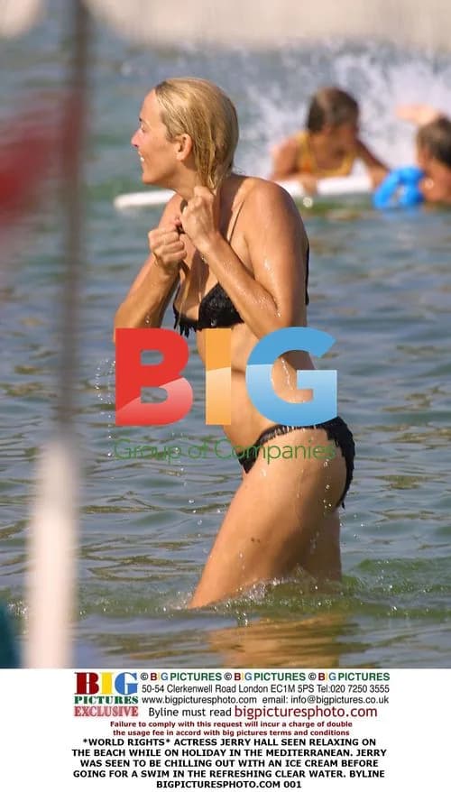 Jerry Hall Relaxes on Beach