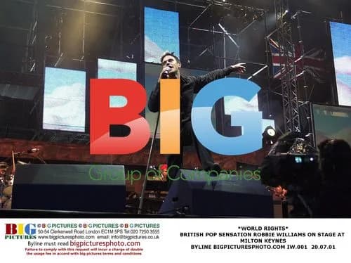 Robbie Williams Performs on Stage