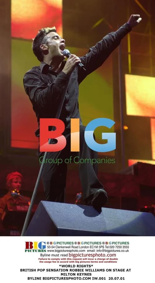 Robbie Williams Performs on Stage in Milton Keynes