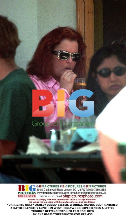 Winona Judd exits car in West Hollywood