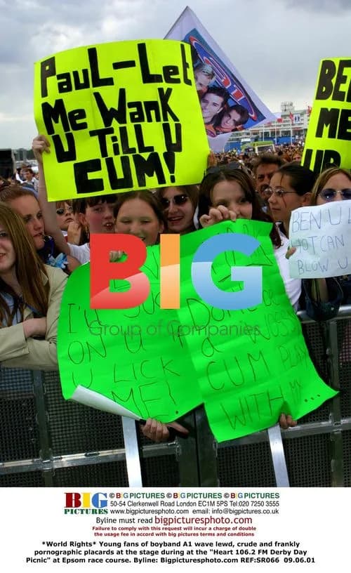 Fans Wave Lewd Placards at A1 Concert